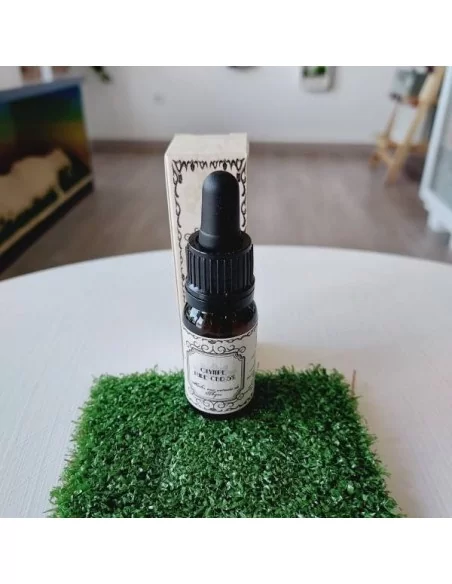 bouteille huile cbd sur herbe